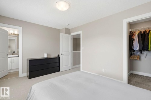 Bedroom featuring light neutral walls and carpet flooring - 206 Southfork Drive, Leduc, AB - Indoor Photo Showing Bedroom