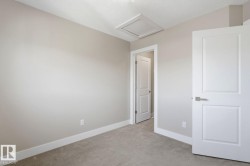 Neutral-toned walls complementing plush carpet flooring - 