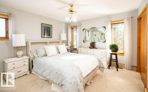 Soft carpet flooring with a ceiling fan overhead - 11007 108 Avenue, Westlock, AB 