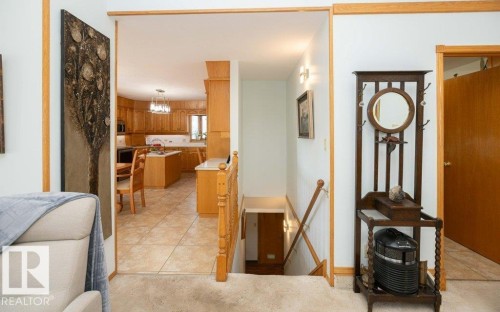 Kitchen with light wood cabinetry, recessed lighting, and tile flooring - 11007 108 Avenue, Westlock, AB 