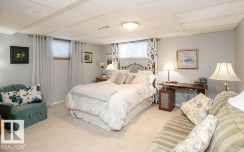 Recessed ceiling lighting, light gray wall paint, and light-colored carpet flooring - 11007 108 Avenue, Westlock, AB 