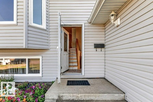 Light gray horizontal siding with white trim - 14527 32 Street Nw, Edmonton, AB 