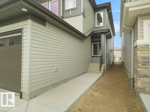 Contemporary exterior with siding and stone accents - 912 17 Ave Nw, Edmonton, AB 