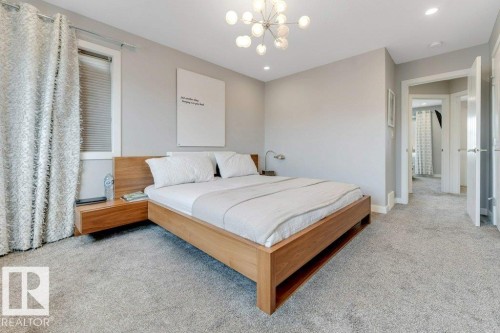 Recessed lighting, contemporary chandelier, light gray wall paint, and gray carpeted flooring - #45 16903 68 St Nw, Edmonton, AB 