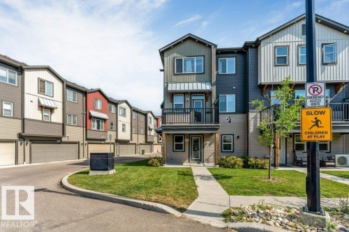 Multi-level townhome featuring a private balcony and a well-maintained lawn - #45 16903 68 St Nw, Edmonton, AB 