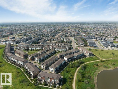 Aerial perspective of a developed residential community with townhomes and detached residences - #45 16903 68 St Nw, Edmonton, AB 