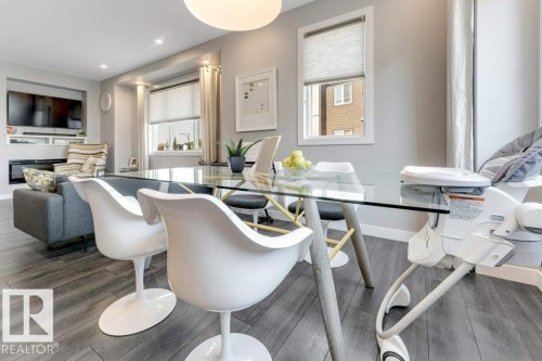 Integrated living space with wood-finish flooring - #45 16903 68 St Nw, Edmonton, AB 