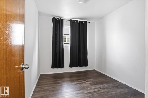 Wood-finish flooring with white walls - 13235 82 Street Nw, Edmonton, AB 