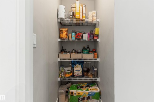 Pantry with multiple wire shelving units - #2205 10226 104 St Nw, Edmonton, AB - Indoor Photo Showing Other Room