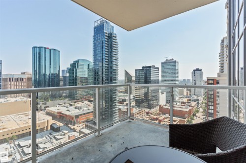 Private balcony featuring a concrete floor and clear glass railing - #2205 10226 104 St Nw, Edmonton, AB - Outdoor With Balcony With View