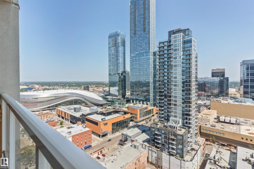 Expansive city panorama featuring multiple modern skyscrapers, a prominent stadium with a curved roof, and a low-rise commercial district - #2205 10226 104 St Nw, Edmonton, AB - Outdoor With Balcony With View