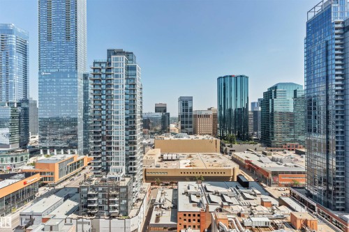 Cityscape featuring multiple high-rise buildings with glass and concrete facades - #2205 10226 104 St Nw, Edmonton, AB - Outdoor
