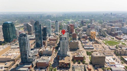 High-rise building situated within a dense urban core, surrounded by numerous commercial and residential structures - #2205 10226 104 St Nw, Edmonton, AB - Outdoor With View
