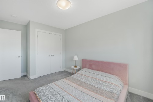 Recessed ceiling lighting, flush-mount ceiling light, light gray wall paint, gray carpeting, and white trim - 6453 177A Avenue Nw, Edmonton, AB 
