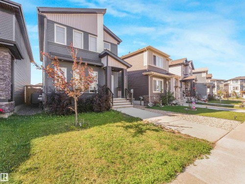 Contemporary exterior with mixed siding and stone accents - 6453 177A Avenue Nw, Edmonton, AB 
