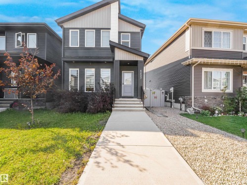 Modern two-story exterior with dark siding and light trim - 6453 177A Avenue Nw, Edmonton, AB 