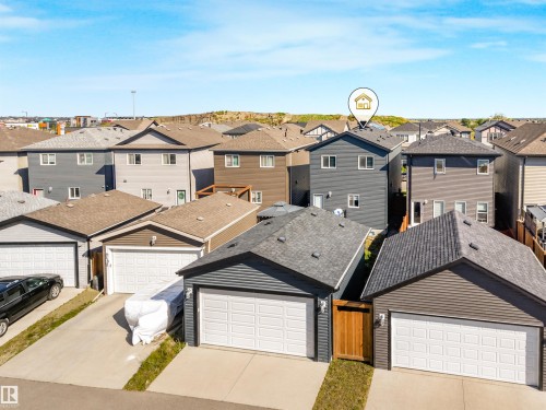 Detached residence featuring dark siding and a private rear yard - 6453 177A Avenue Nw, Edmonton, AB 