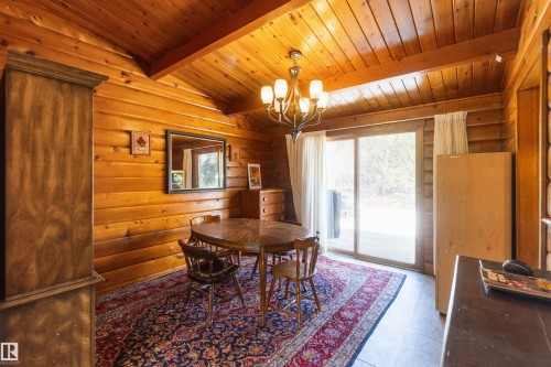 Room with natural wood plank walls and an angled wood plank ceiling - 910 Hermitage Avenue, Rural Parkland County, AB - Indoor Photo Showing Dining Room