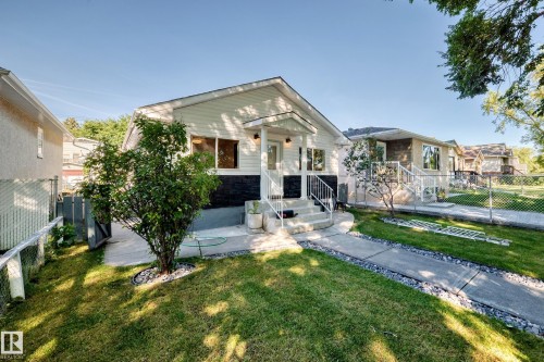 White siding exterior with a dark-toned foundation - Edmonton, AB 