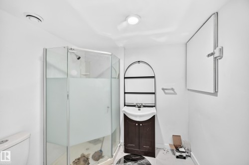 Corner glass shower enclosure with frosted privacy panels - Edmonton, AB 