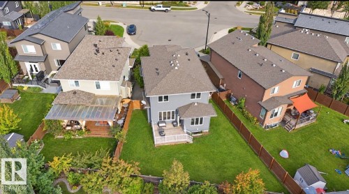 Expansive green lawn with established trees and privacy fencing - 885 Windermere Wynd Nw, Edmonton, AB 