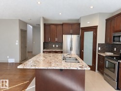 Kitchen island with granite countertop and double stainless steel sink - 