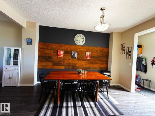 Accent wall featuring wood paneling - 5169 Chappelle Rd Southwest, Edmonton, AB 