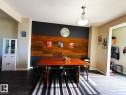 Accent wall featuring wood paneling - 5169 Chappelle Rd Southwest, Edmonton, AB 