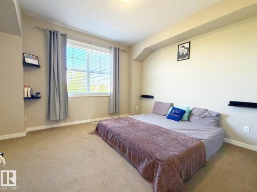 Recessed window with horizontal blinds - 5169 Chappelle Rd Southwest, Edmonton, AB 