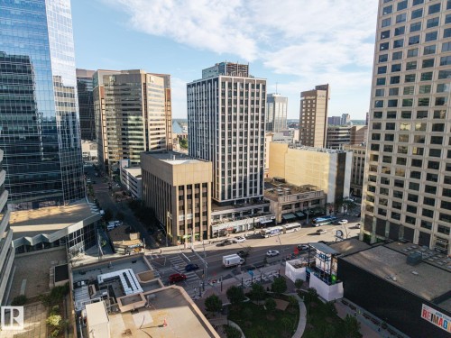 Urban landscape featuring a variety of high-rise buildings and street-level activity - #1313 10024 Jasper Av Nw, Edmonton, AB 
