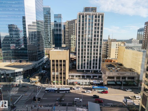 Urban setting with prominent high-rise buildings and street-level activity - #1313 10024 Jasper Av Nw, Edmonton, AB 