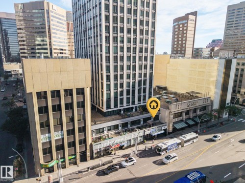 Urban setting featuring multiple high-rise buildings and street-level commercial establishments - #1313 10024 Jasper Av Nw, Edmonton, AB 