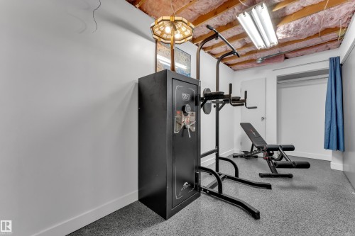 Recessed lighting, painted walls, and an open ceiling with visible insulation - 442 Kirkpatrick Crescent Nw, Edmonton, AB 