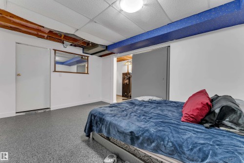 Recessed lighting, drop ceiling, and durable flooring with a flecked finish - 442 Kirkpatrick Crescent Nw, Edmonton, AB 