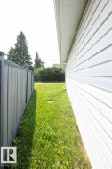 White vinyl siding exterior with a soffit and fascia system - 