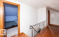 Wood-finish flooring throughout the hallway and room - 
