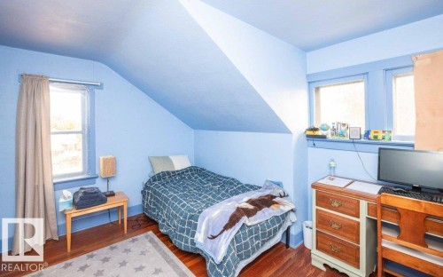 Hardwood-style flooring throughout - 10940 100A Ave, Westlock, AB - Indoor Photo Showing Bedroom