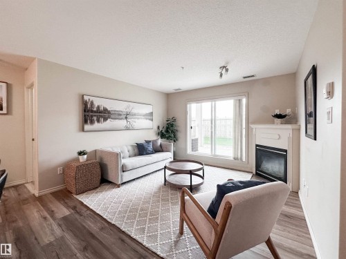 #140 78B Mckenney Av, St. Albert, AB - Indoor Photo Showing Living Room With Fireplace