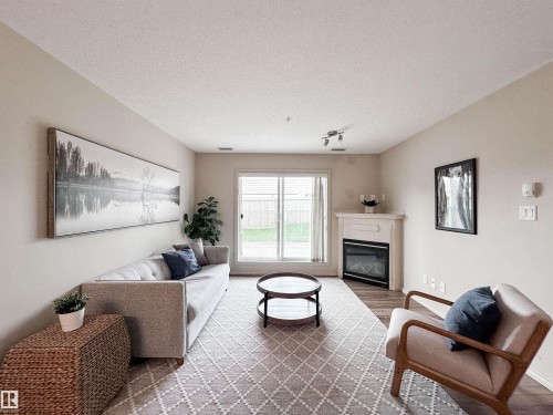 #140 78B Mckenney Av, St. Albert, AB - Indoor Photo Showing Living Room With Fireplace