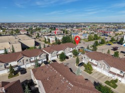 Townhome property with attached garages and shingled roofs - 