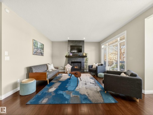 5610 Pierre Court, Beaumont, AB - Indoor Photo Showing Living Room With Fireplace