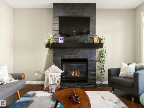 5610 Pierre Court, Beaumont, AB - Indoor Photo Showing Living Room With Fireplace