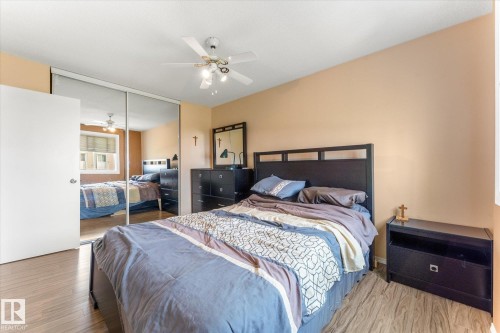 Wood-finish flooring extending throughout the room - 173 Cornell Court Nw, Edmonton, AB - Indoor Photo Showing Bedroom