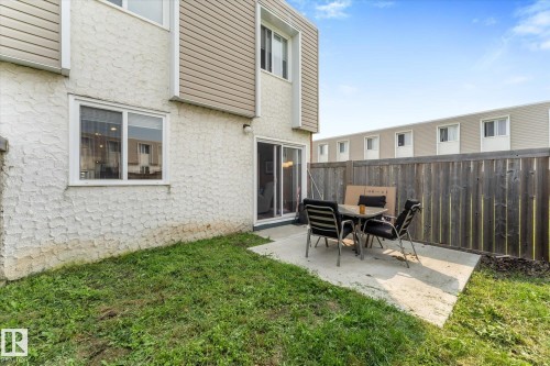 Outdoor patio area featuring a concrete slab and wooden privacy fencing - 173 Cornell Court Nw, Edmonton, AB - Outdoor