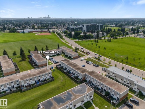 Townhome property featuring a flat roofline and private patio areas - 173 Cornell Court Nw, Edmonton, AB - Outdoor With View