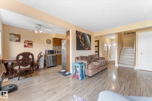 Open-concept living space featuring wood-finish flooring and light-toned walls - 173 Cornell Court Nw, Edmonton, AB - Indoor Photo Showing Living Room