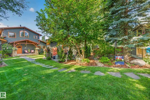 Expansive lawn area with stone pathway - 51 Itaska Beach, Rural Leduc County, AB 