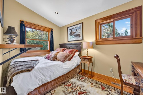 Warm-toned walls complement wood-framed windows - 51 Itaska Beach, Rural Leduc County, AB 