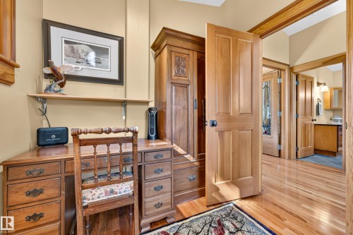 Wood-finish flooring, solid wood doors, and detailed wood trim - 51 Itaska Beach, Rural Leduc County, AB 