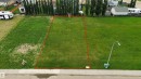 Grassed residential building lot with mature trees at the rear boundary - 23 Monterey Estates, Wetaskiwin, AB 